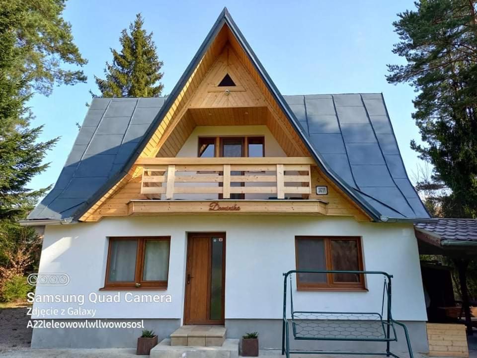 a house with solar panels on the roof at Chata Dominika in Smižany