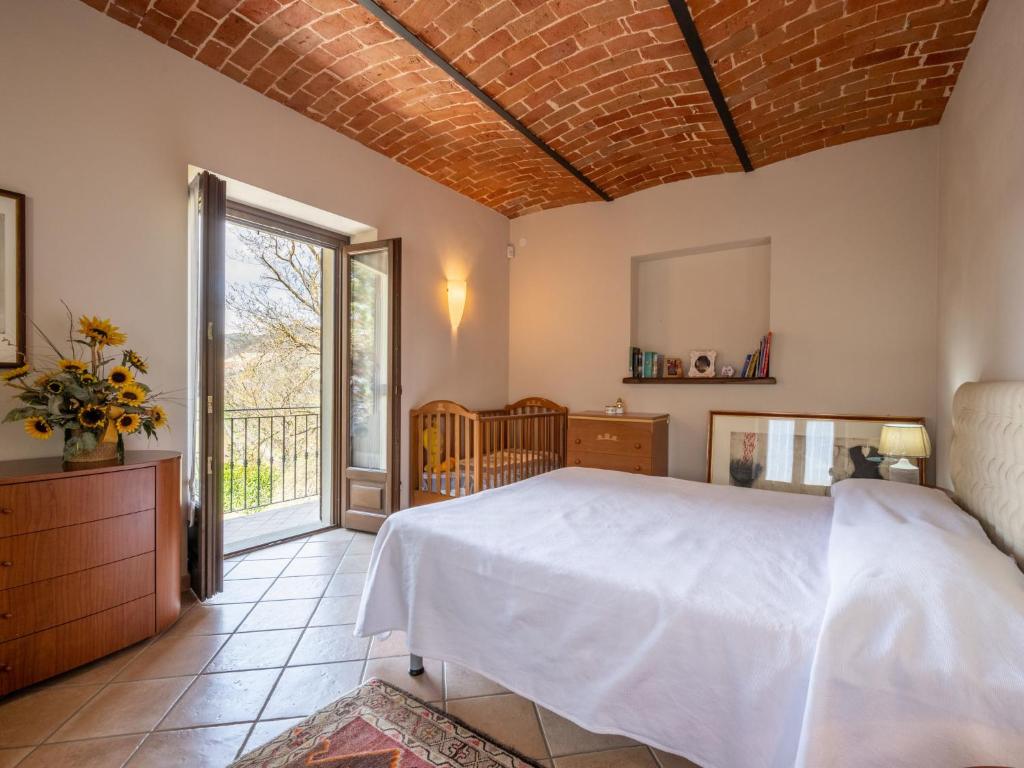 A bed or beds in a room at Holiday Home Castellaio by Interhome