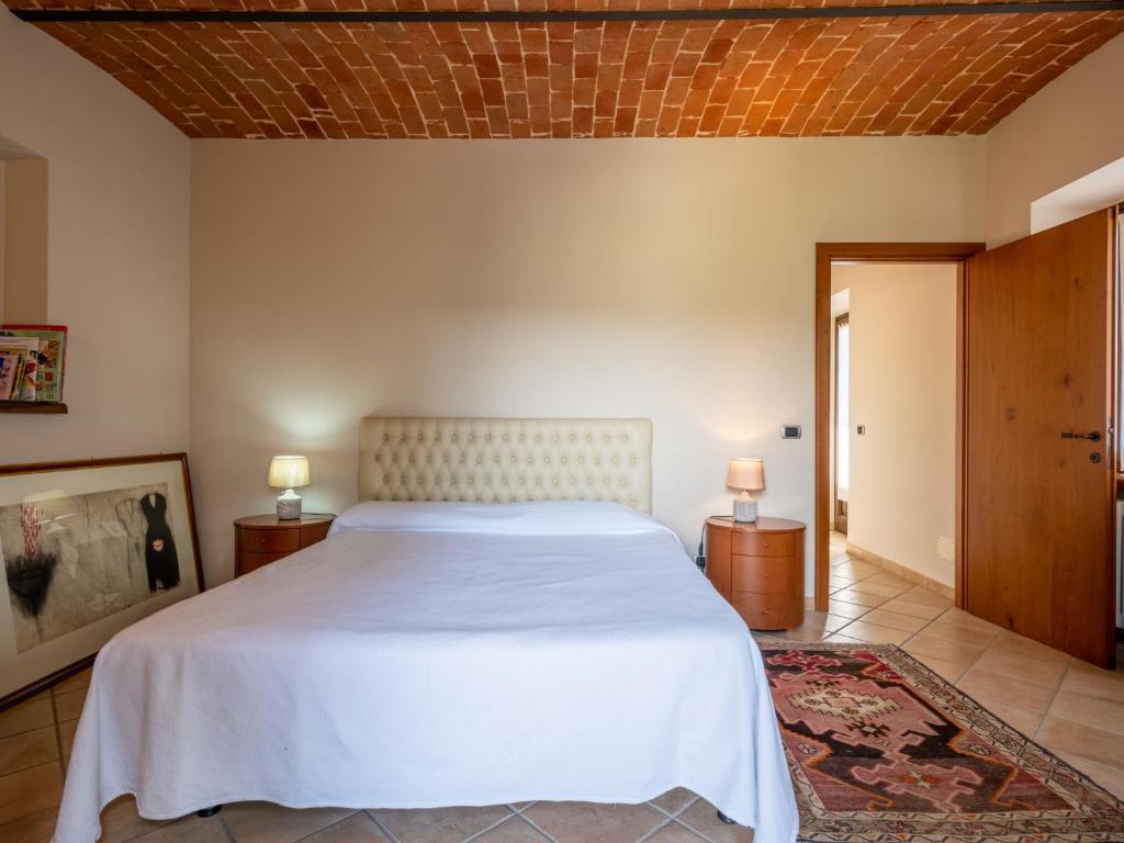 A bed or beds in a room at Holiday Home Castellaio by Interhome