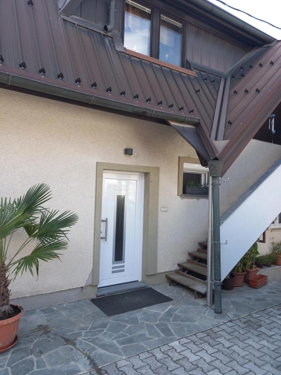 awning over a front door of a house at Stara Jezica Apartments with WiFi in Ljubljana