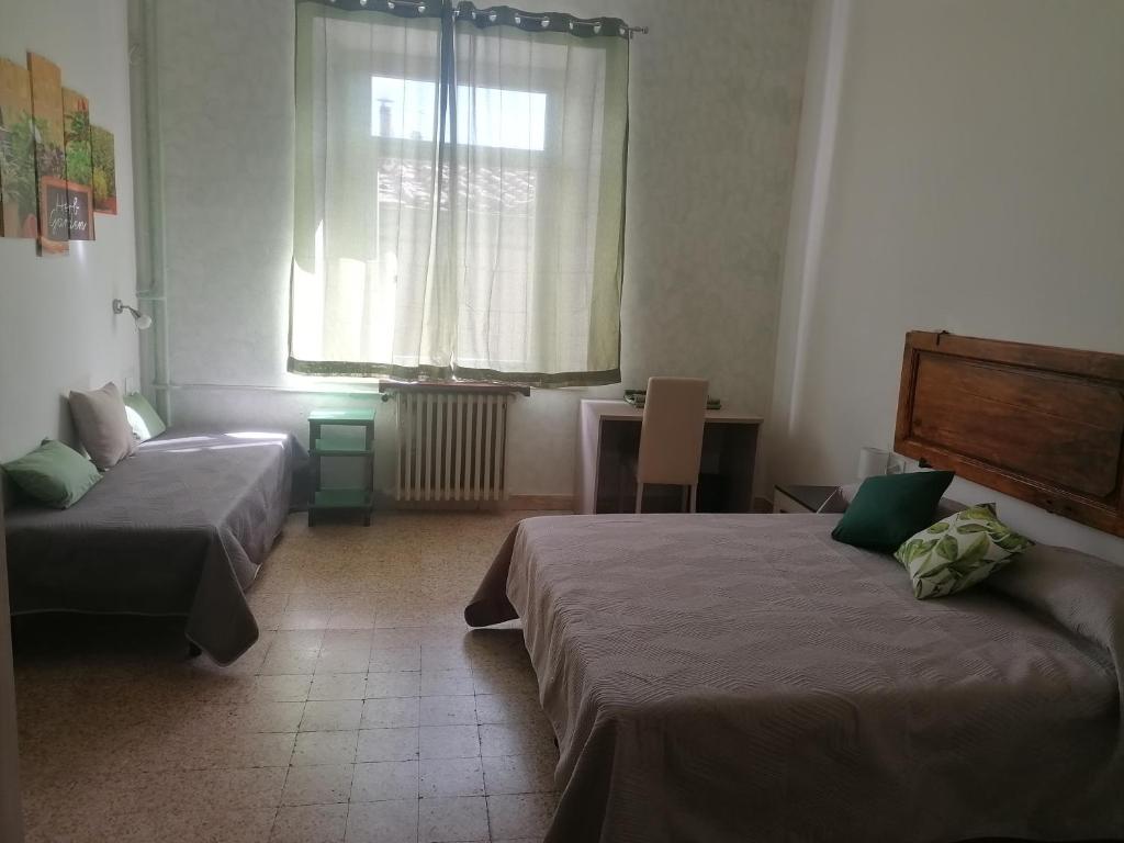 Łóżko lub łóżka w pokoju w obiekcie Agriturismo Poggio alla Luna