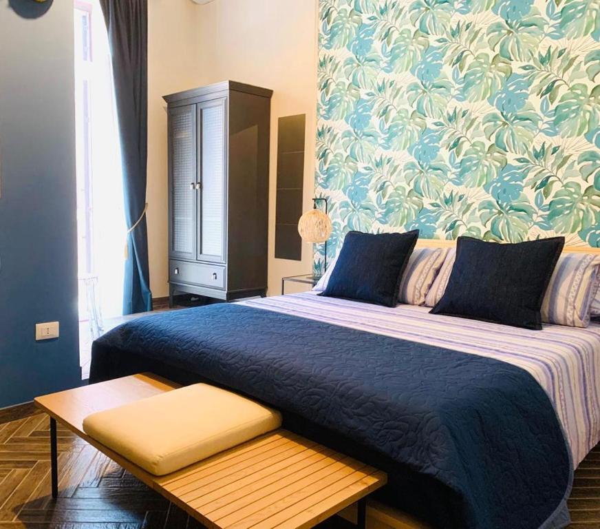 Ένα ή περισσότερα κρεβάτια σε δωμάτιο στο Sogno Botanico