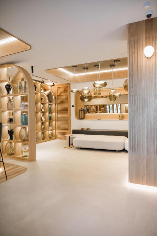 a wine tasting room with a white floor and wooden cabinets at MYR Puerta Serranos in Valencia