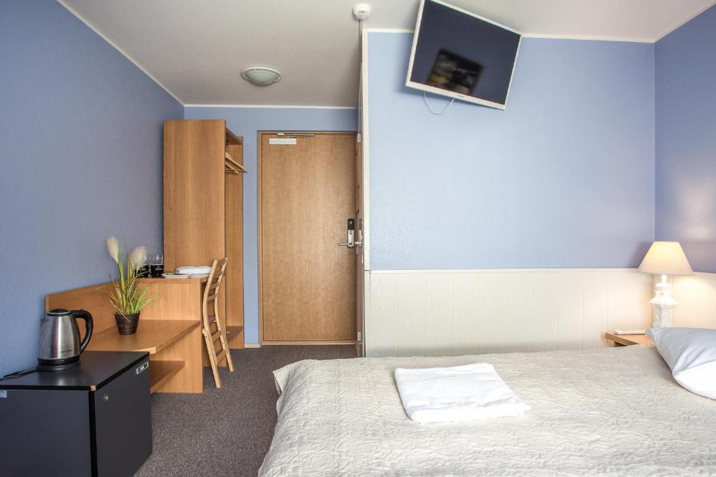 Postel nebo postele na pokoji v ubytování Pärnu Villa Harmony