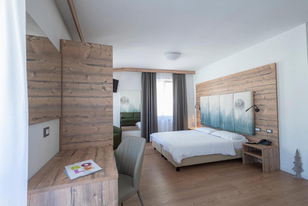Postel nebo postele na pokoji v ubytování Hotel Cova