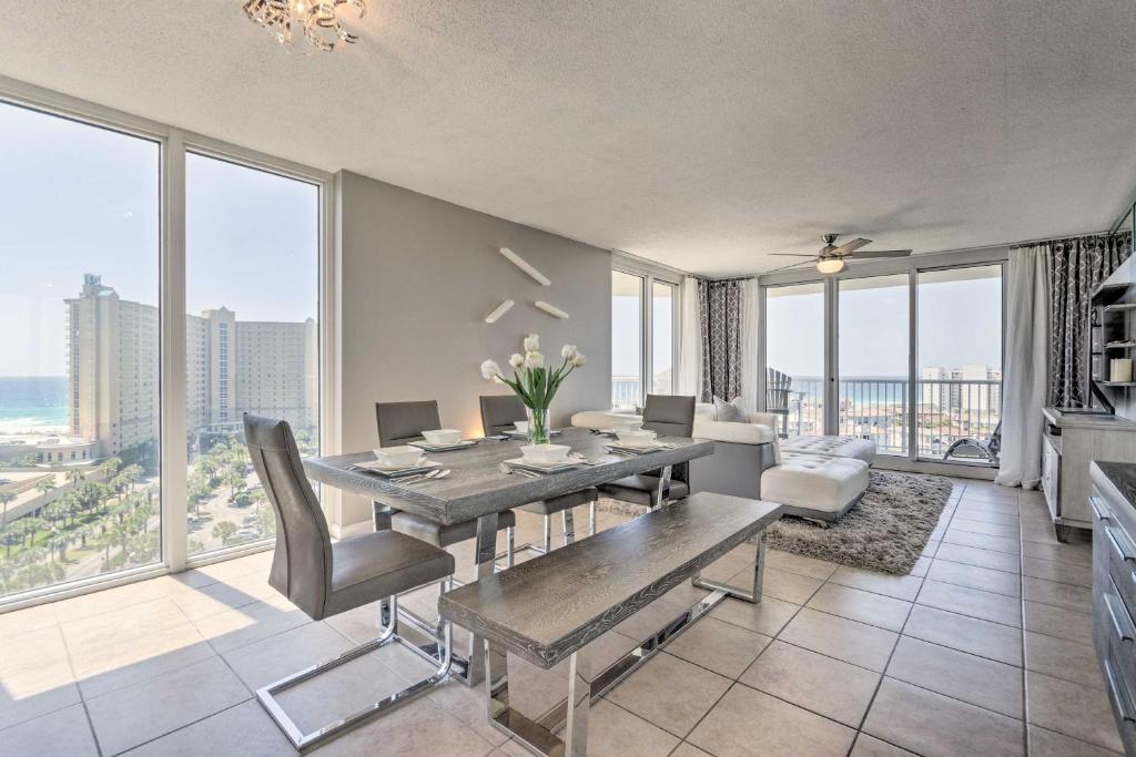 a dining room with a table and views of the ocean at The Terrace at Pelican Beach Resort: View + Pool! in Destin