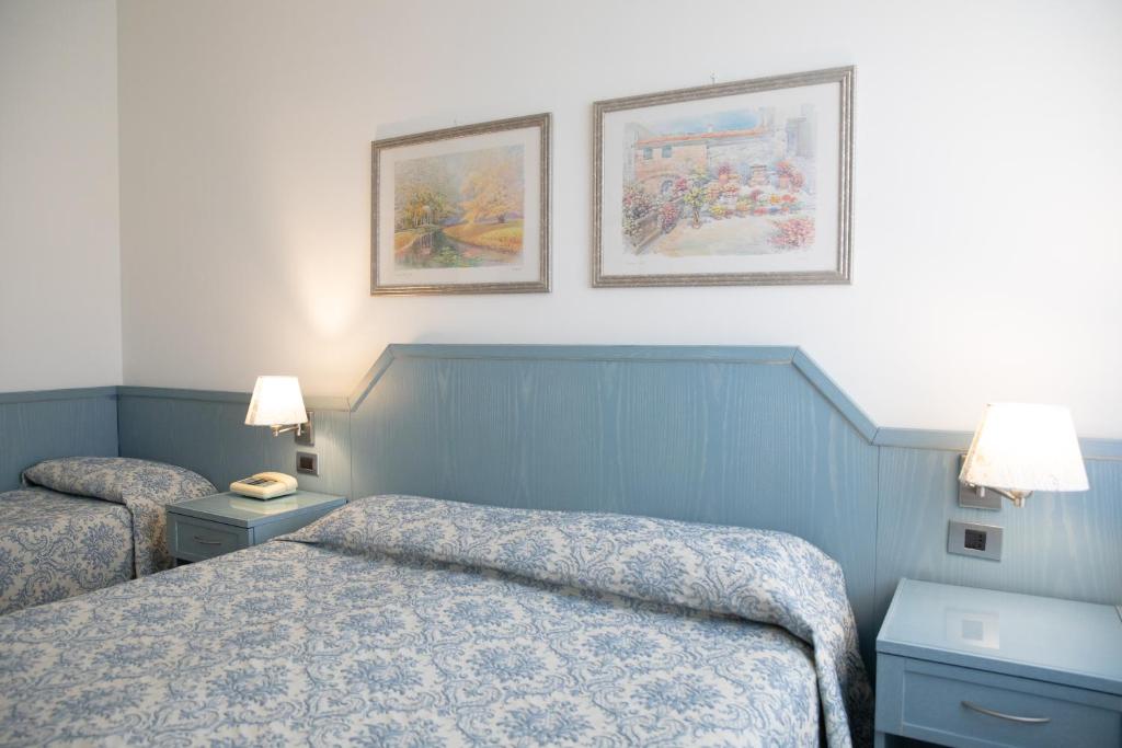 Postel nebo postele na pokoji v ubytování Hotel Ariston