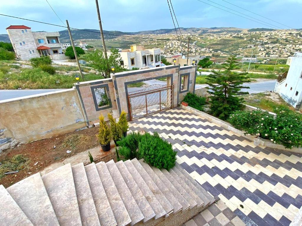a house with a roof with plants on it at Black Ires in Jerash