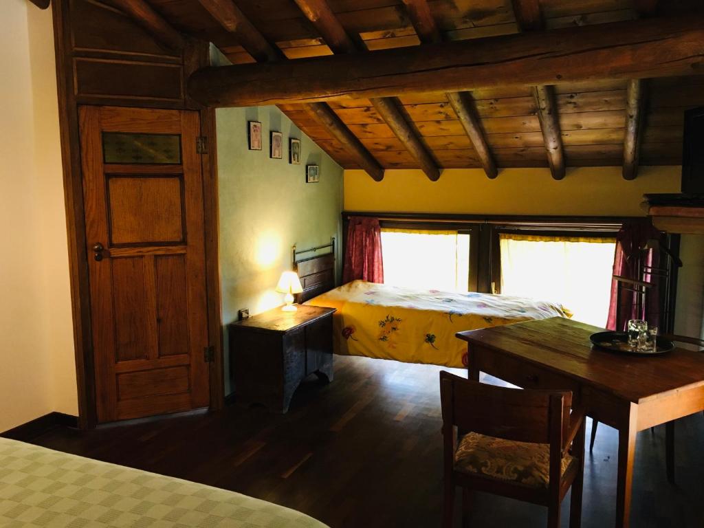 Postel nebo postele na pokoji v ubytování B&B Ai Tre Confini