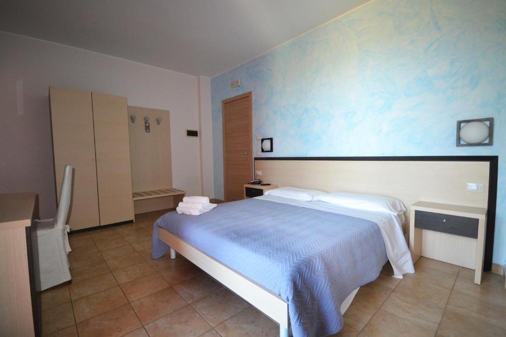 Posteľ alebo postele v izbe v ubytovaní Hotel La Siesta