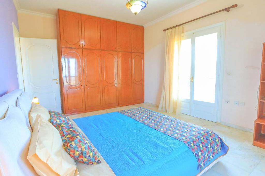 Postel nebo postele na pokoji v ubytování Villa Eftihia