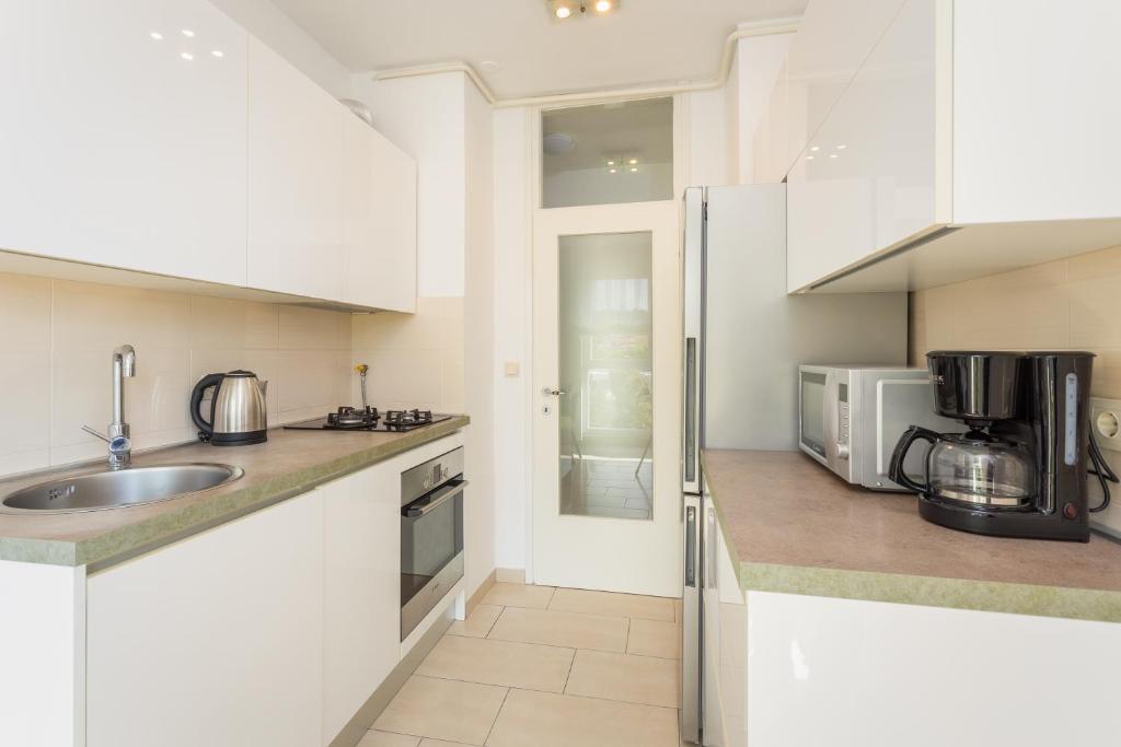 Kuchyň nebo kuchyňský kout v ubytování Apartment Starfish Pula