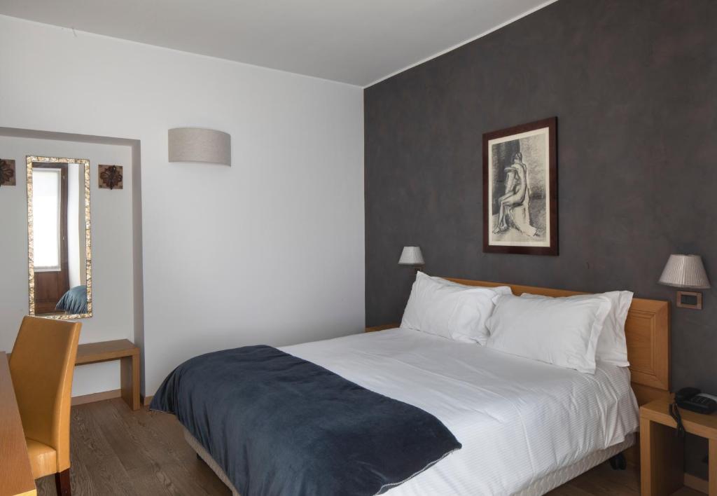 Posteľ alebo postele v izbe v ubytovaní Hotel 99 Cannelle