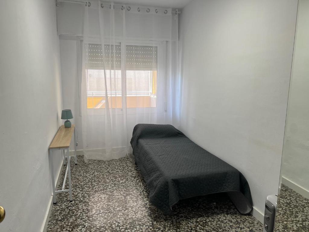 Posteľ alebo postele v izbe v ubytovaní COSTA DAURADA APARTAMENTS - Molins II