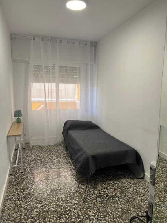 Posteľ alebo postele v izbe v ubytovaní COSTA DAURADA APARTAMENTS - Molins II