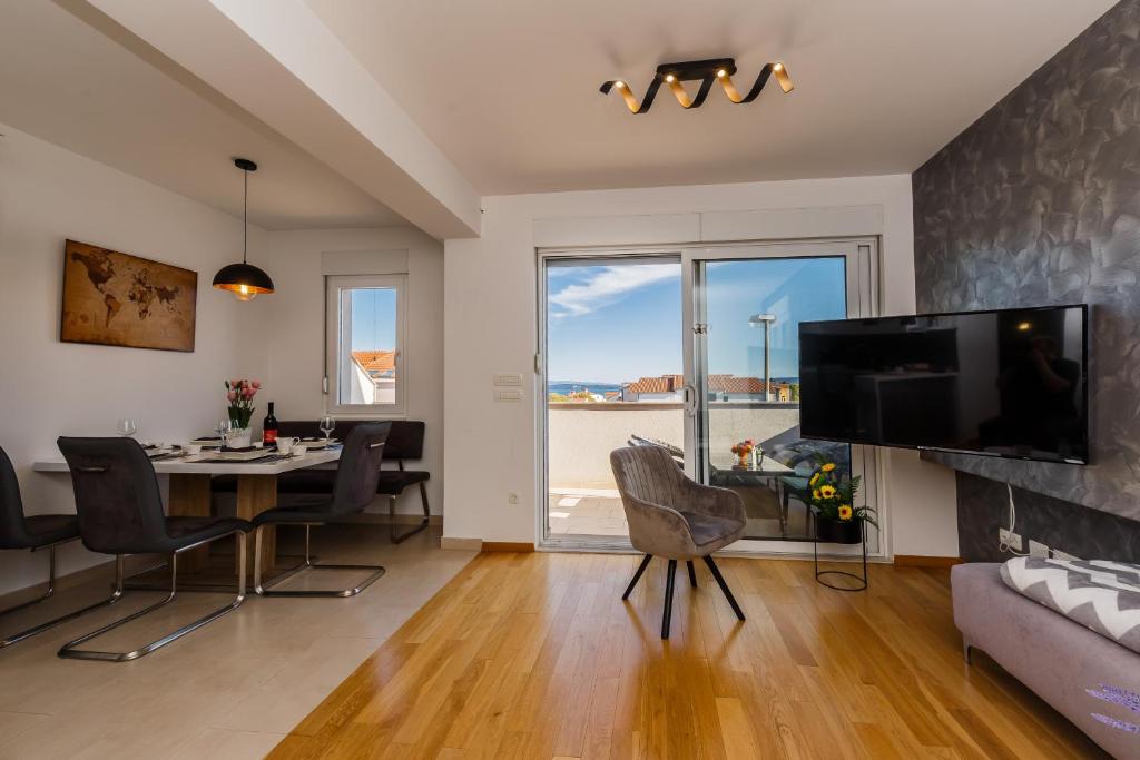 Televízia a/alebo spoločenská miestnosť v ubytovaní Apartment Angels