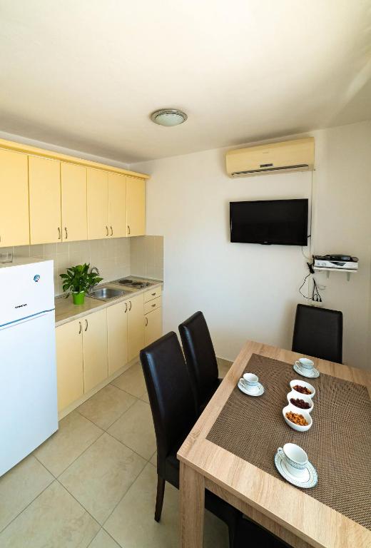 Kuchyň nebo kuchyňský kout v ubytování Apartments M&S