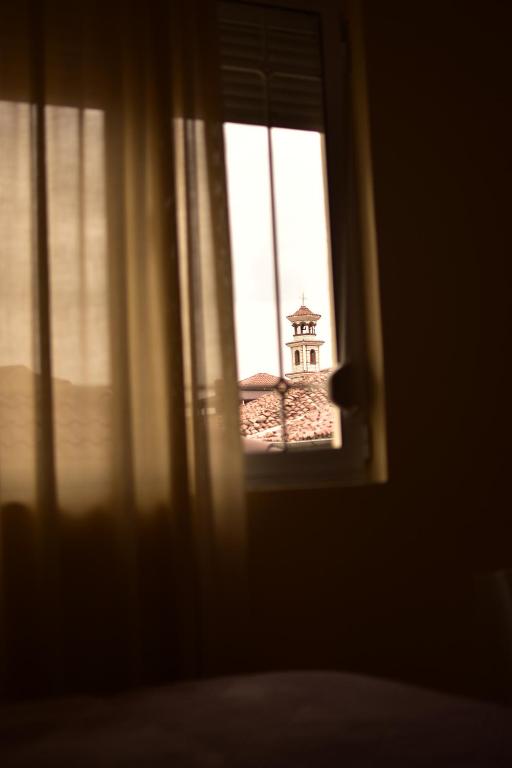 Postel nebo postele na pokoji v ubytování Vila Visi Hotel