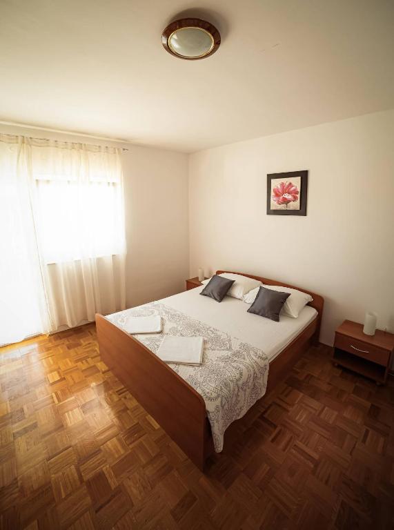 Postel nebo postele na pokoji v ubytování Apartments M&S