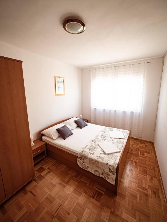 Postel nebo postele na pokoji v ubytování Apartments M&S