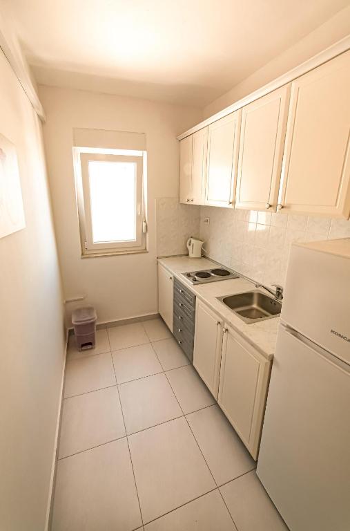 Kuchyň nebo kuchyňský kout v ubytování Apartments M&S
