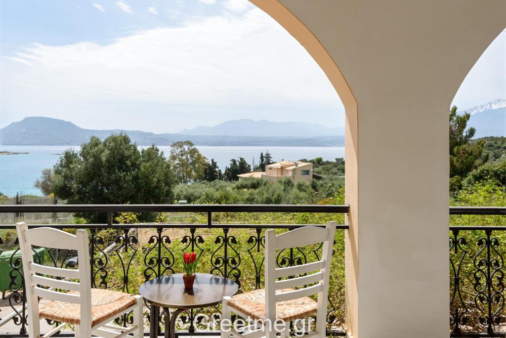 a view from the balcony of a house with a table and chairs at Angela Apartments new listing in Marathi