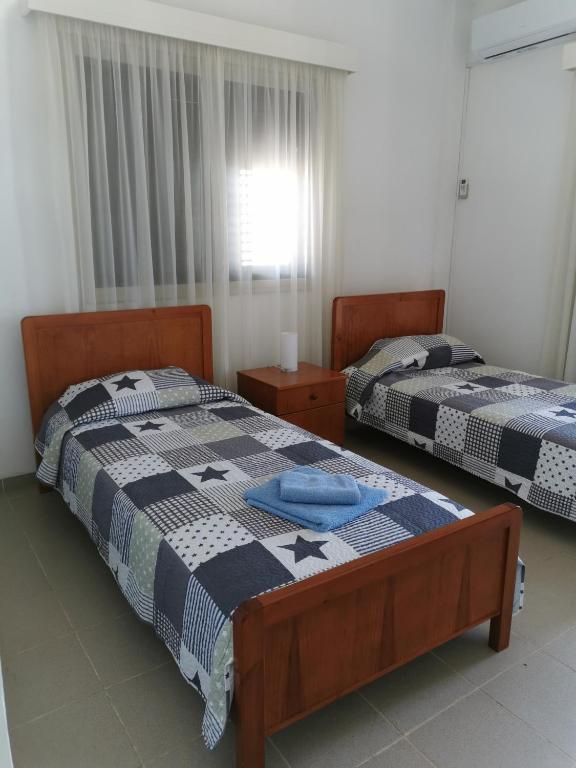 Postel nebo postele na pokoji v ubytování Seaclusion Vacation Villa