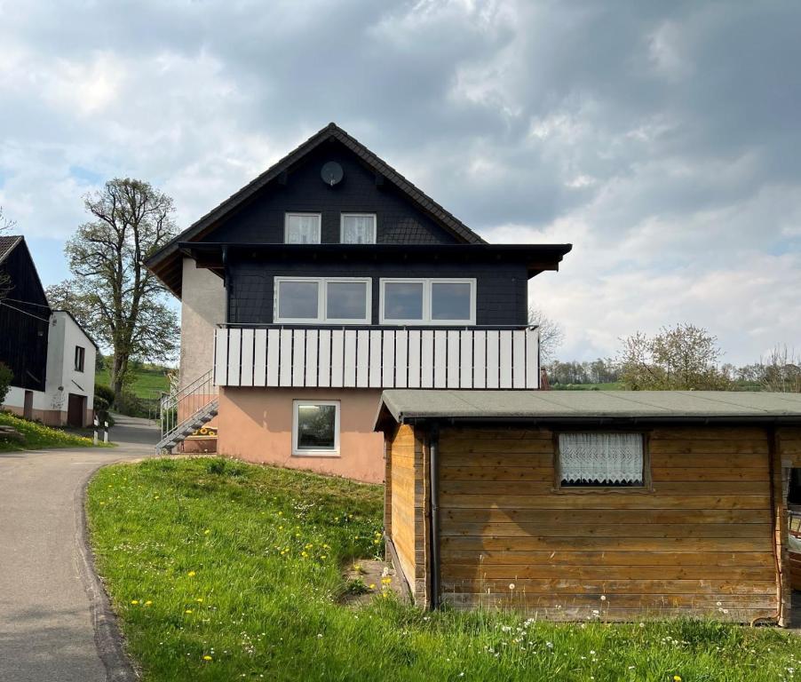 a house with a garage in front of it at Hannis-Hof in Meinerzhagen