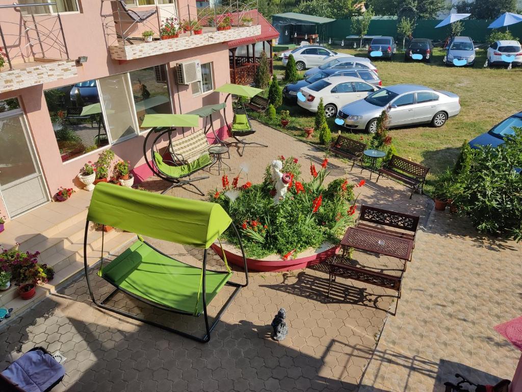 an overhead view of a patio with chairs and plants at Vila Fery Costinesti in Costinesti