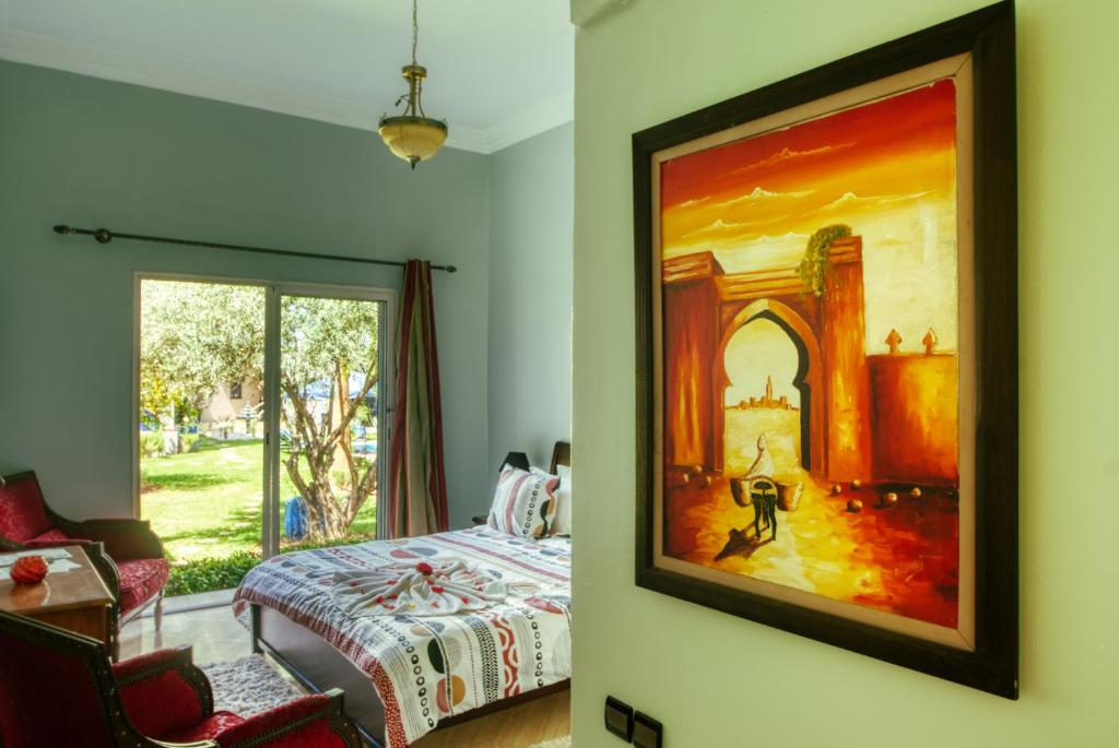 Postel nebo postele na pokoji v ubytování Villas 95 Appart'Hôtel