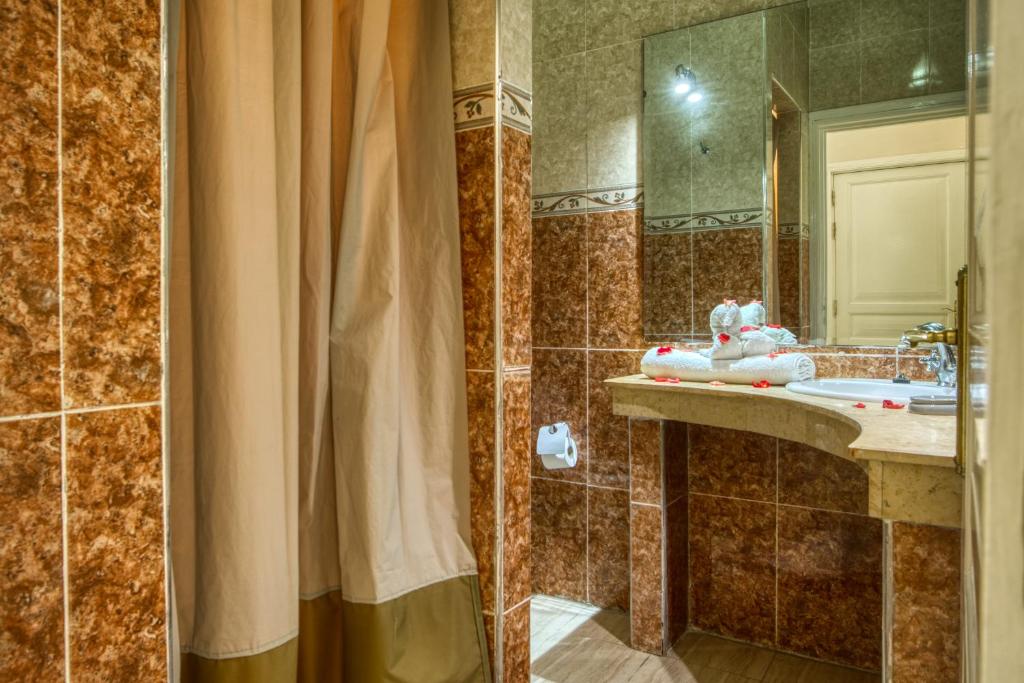 Koupelna v ubytování Villas 95 Appart'Hôtel