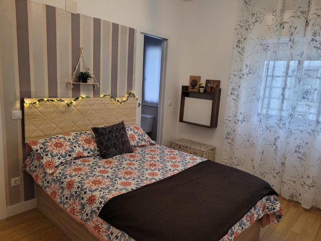 A bed or beds in a room at Piso Stylety Alcazar