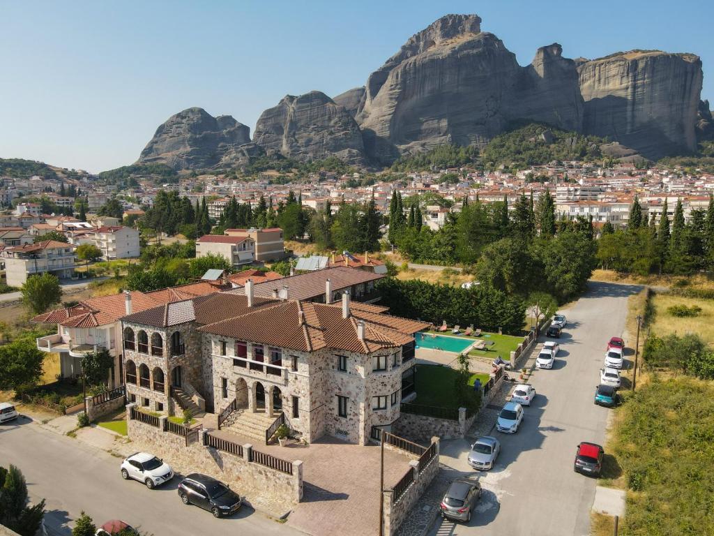 an aerial view of a city with mountains in the background at Monastiri Guesthouse in Kalabaka