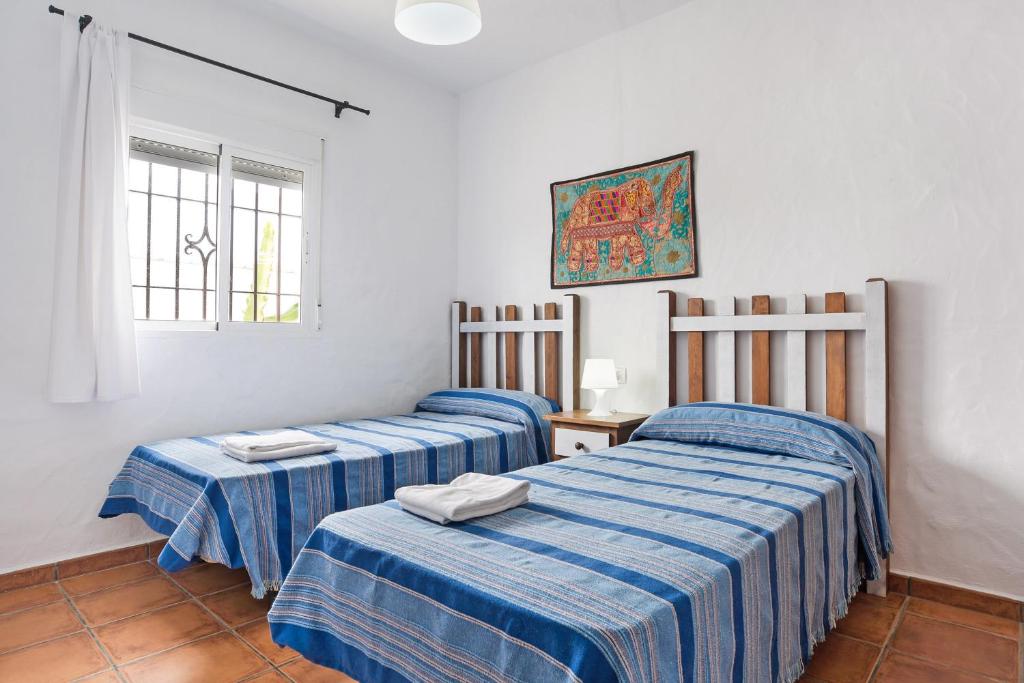 Postel nebo postele na pokoji v ubytování Casa Playamar