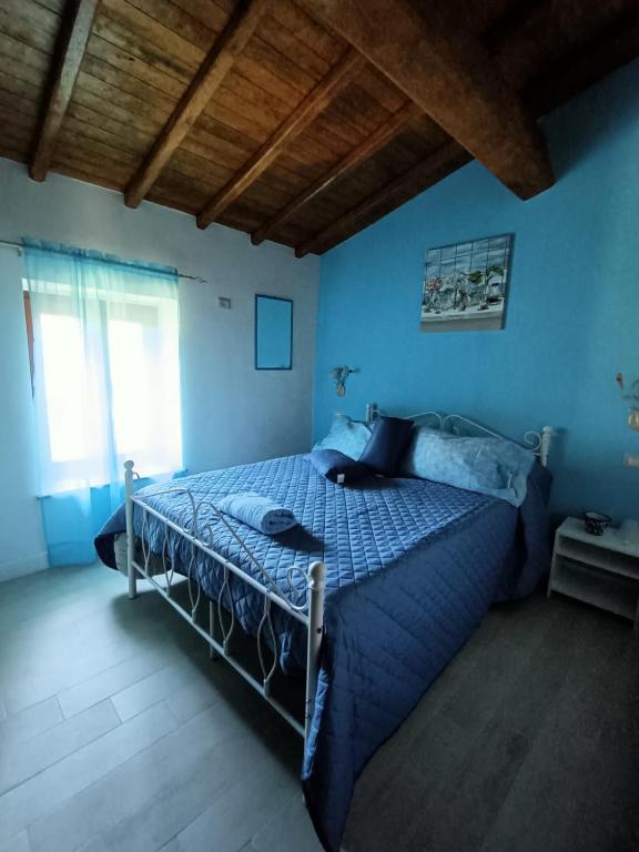 Letto o letti in una camera di B&B Il Grifo