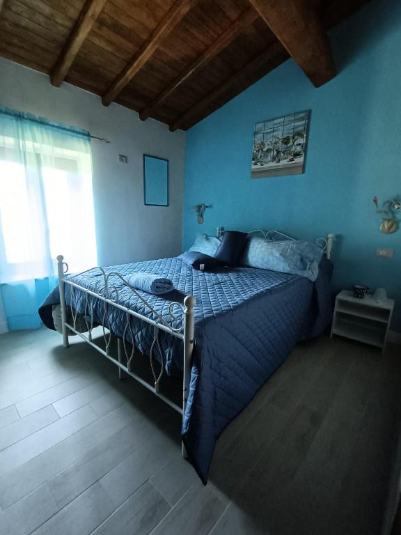 Letto o letti in una camera di B&B Il Grifo