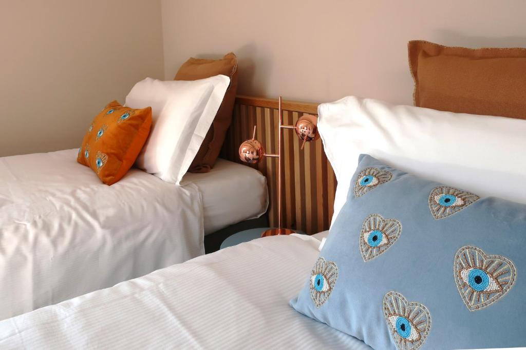 Een bed of bedden in een kamer bij Picobello Lago