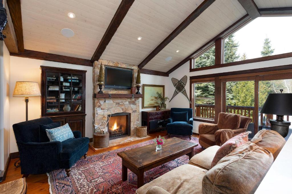 a living room with a couch and a fireplace at 8166A SUITE Nicklaus North in Whistler