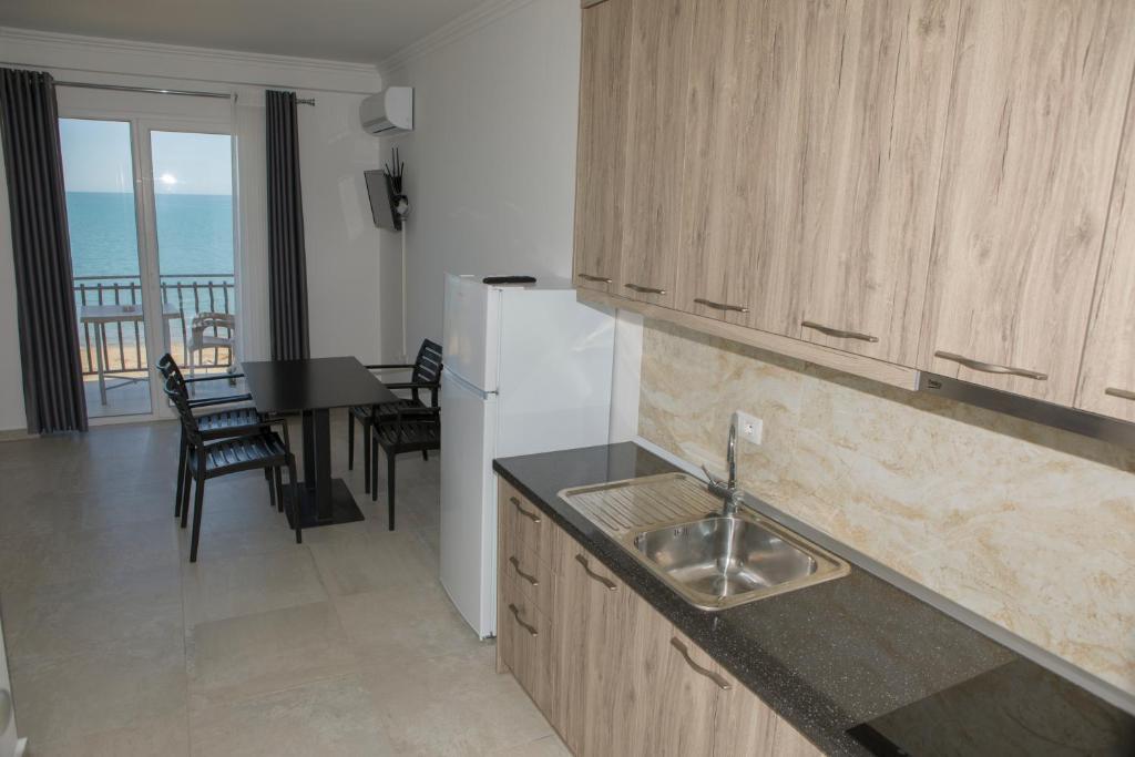 Kuchyň nebo kuchyňský kout v ubytování Soluna Apartments