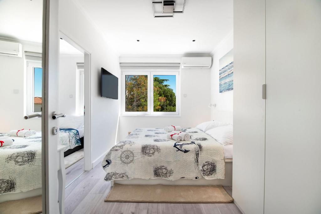 Posteľ alebo postele v izbe v ubytovaní Apartment Ella