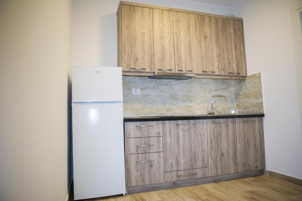 Kuchyň nebo kuchyňský kout v ubytování Soluna Apartments