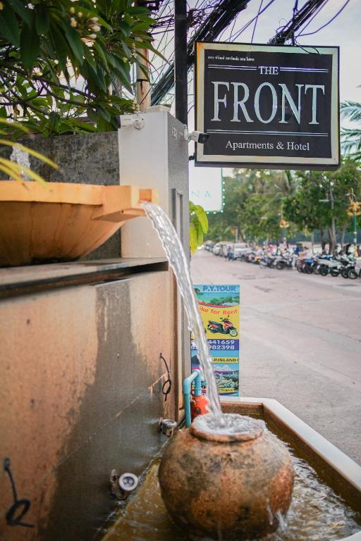 a fire hydrant with water coming out of it at The Front Hotel and Apartments in Patong Beach