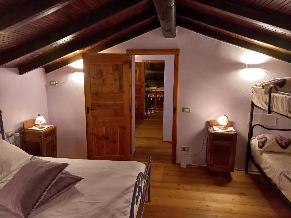 Postel nebo postele na pokoji v ubytování Il paradiso delle beccacce