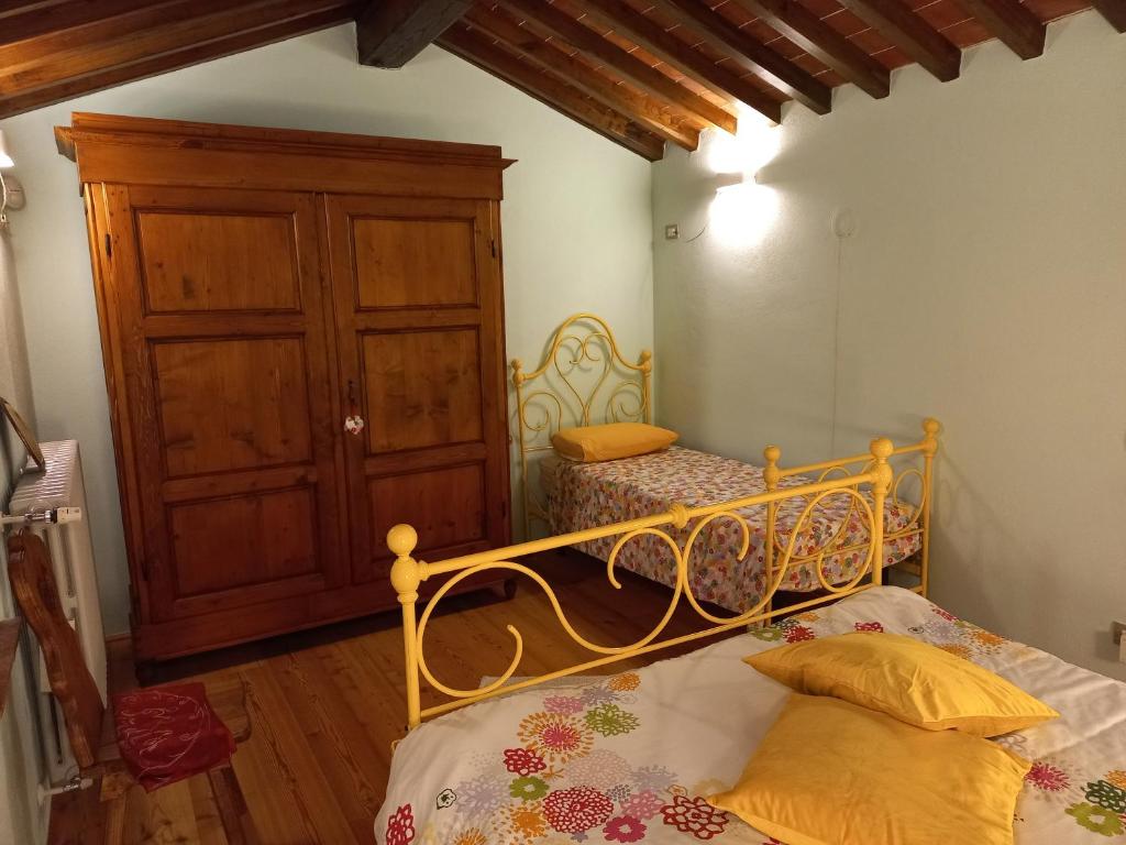 Postel nebo postele na pokoji v ubytování Il paradiso delle beccacce