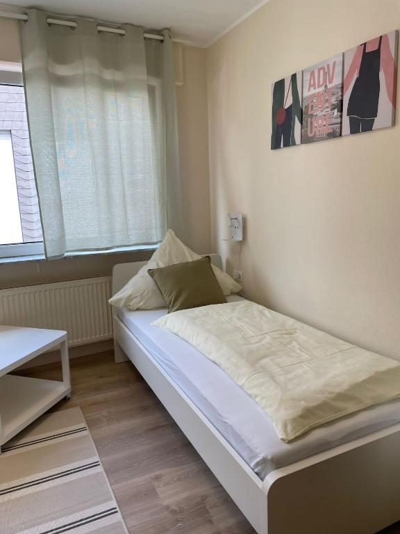 Postel nebo postele na pokoji v ubytování Gasthaus Stammbaum
