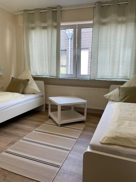 Postel nebo postele na pokoji v ubytování Gasthaus Stammbaum