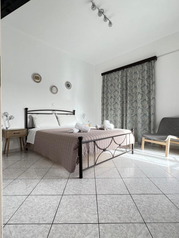 Postel nebo postele na pokoji v ubytování Xanthi Apartments