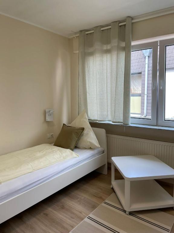 Postel nebo postele na pokoji v ubytování Gasthaus Stammbaum