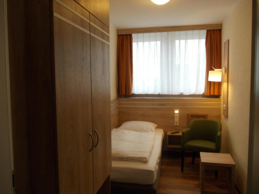 Postel nebo postele na pokoji v ubytování Berghotel Glockenberg