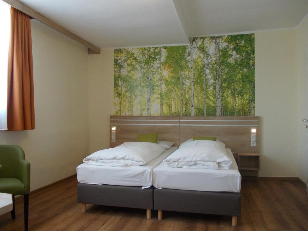 Postel nebo postele na pokoji v ubytování Berghotel Glockenberg